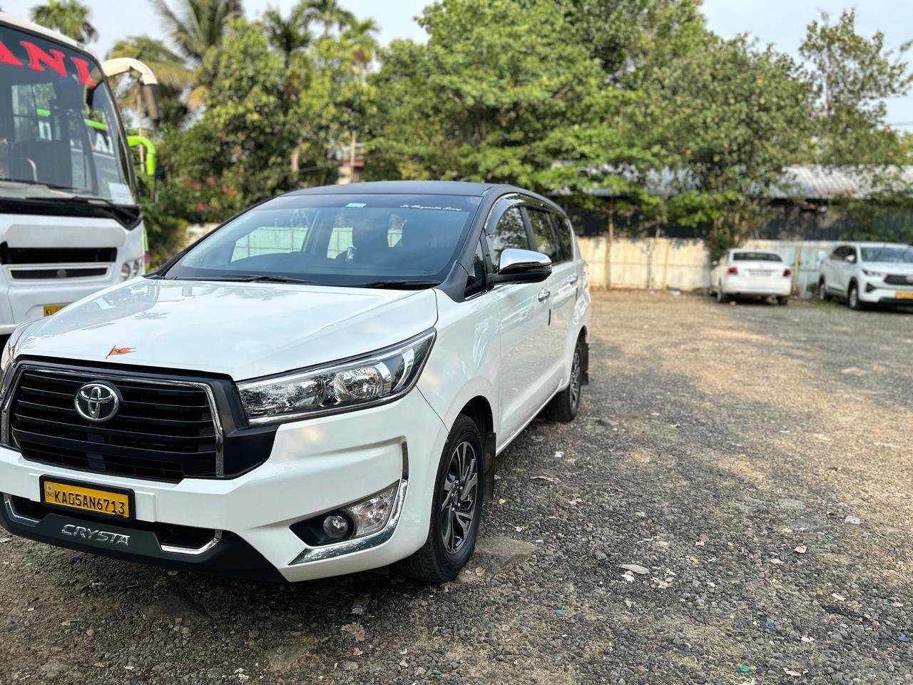 Toyota Innova Crysta white outstation taxi front side view